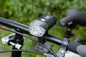 A noite que monta a bicicleta recarregável do diodo emissor de luz ilumina o ABS do brilho de 50%